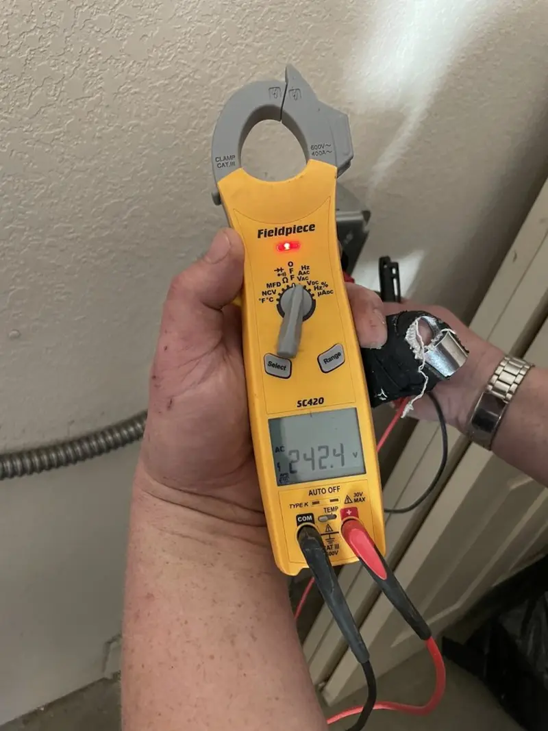 Voltage testing with clamp meter during Aluminum Wiring Replacement in Asbury